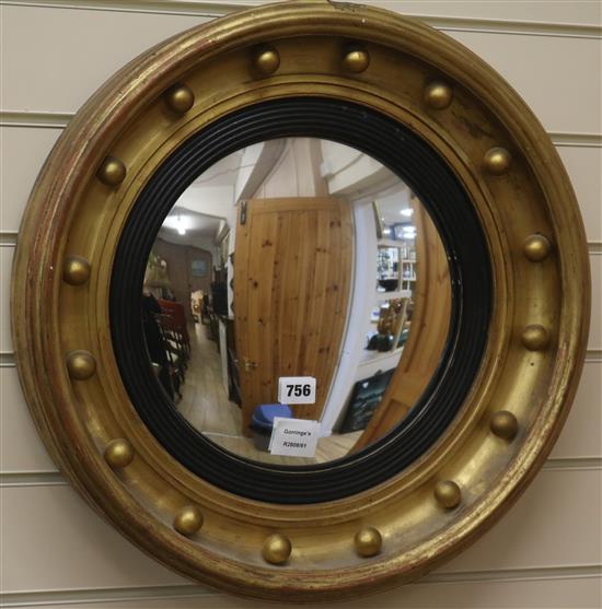 A gilt convex wall mirror W.51cm
